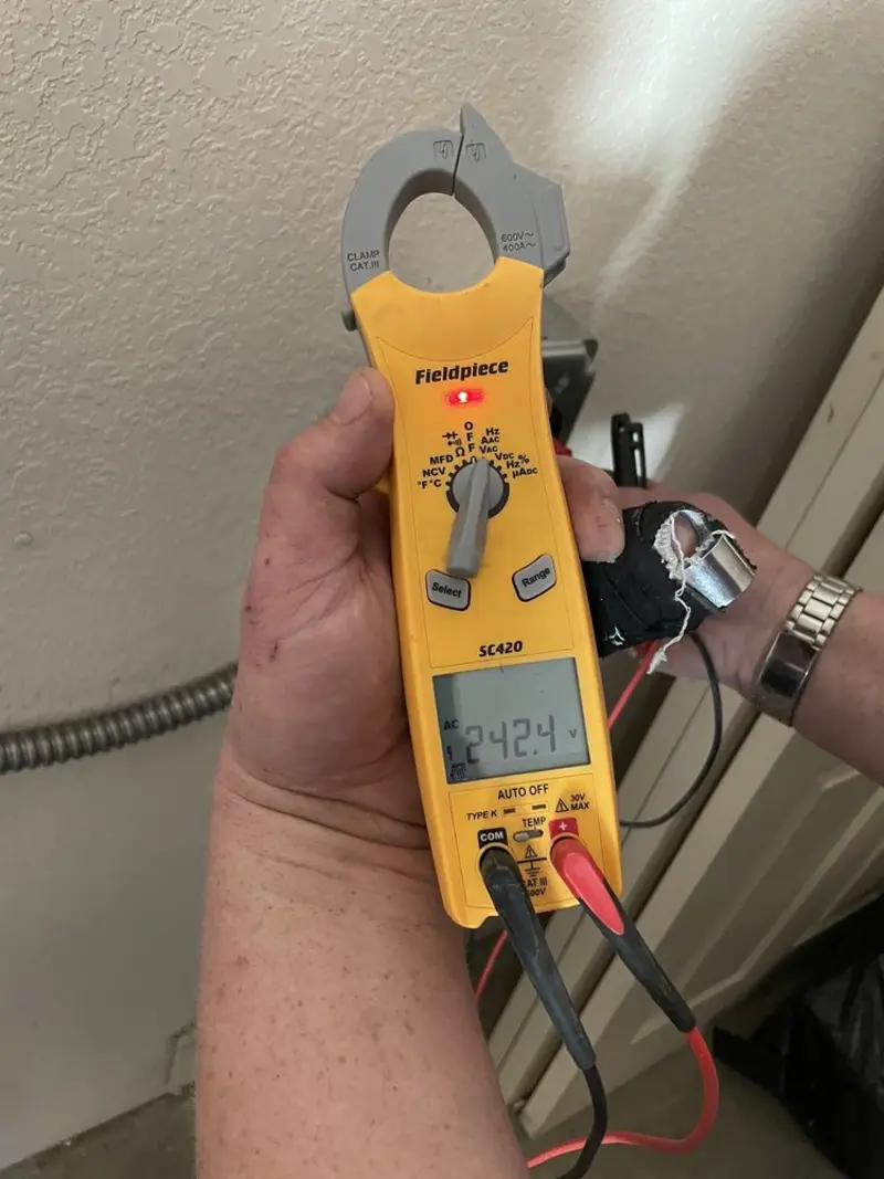 Voltage testing with clamp meter during Generator Installation in Knoxville